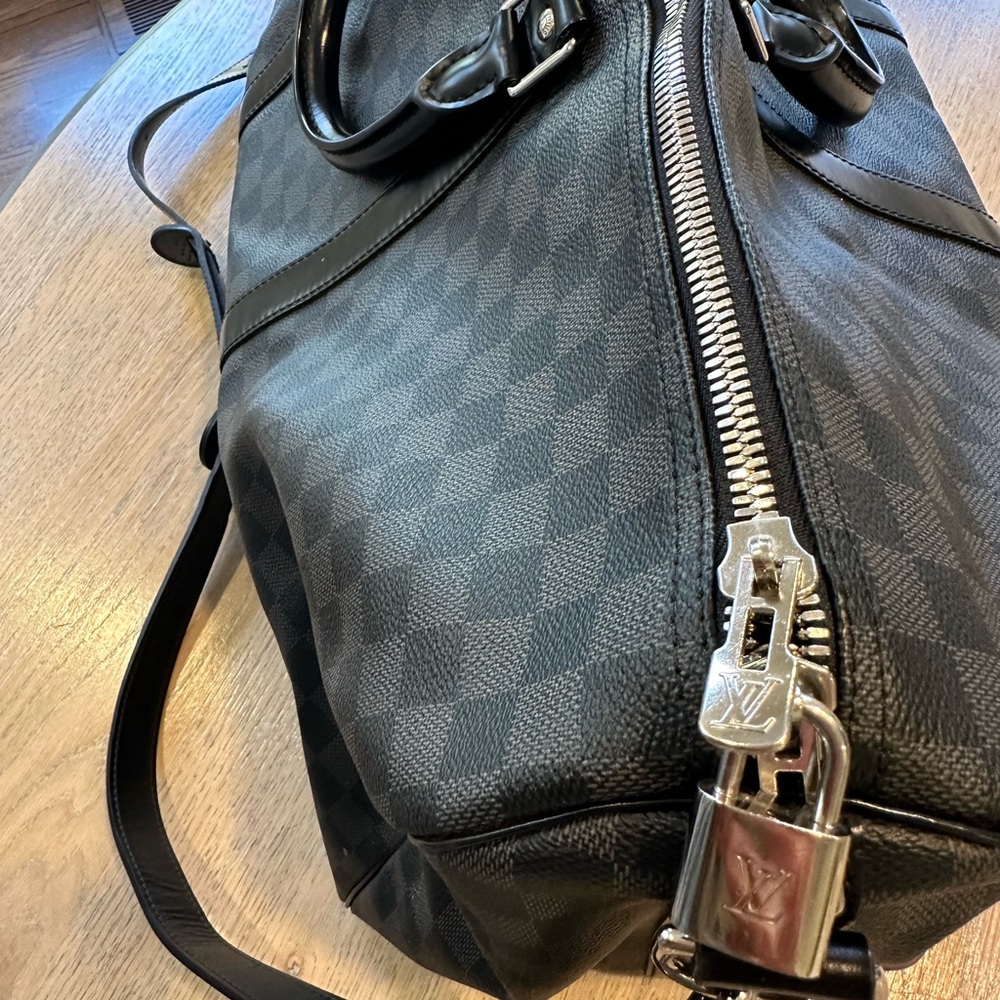 Some light wear and tear. In great condition except part of the strap-see photo